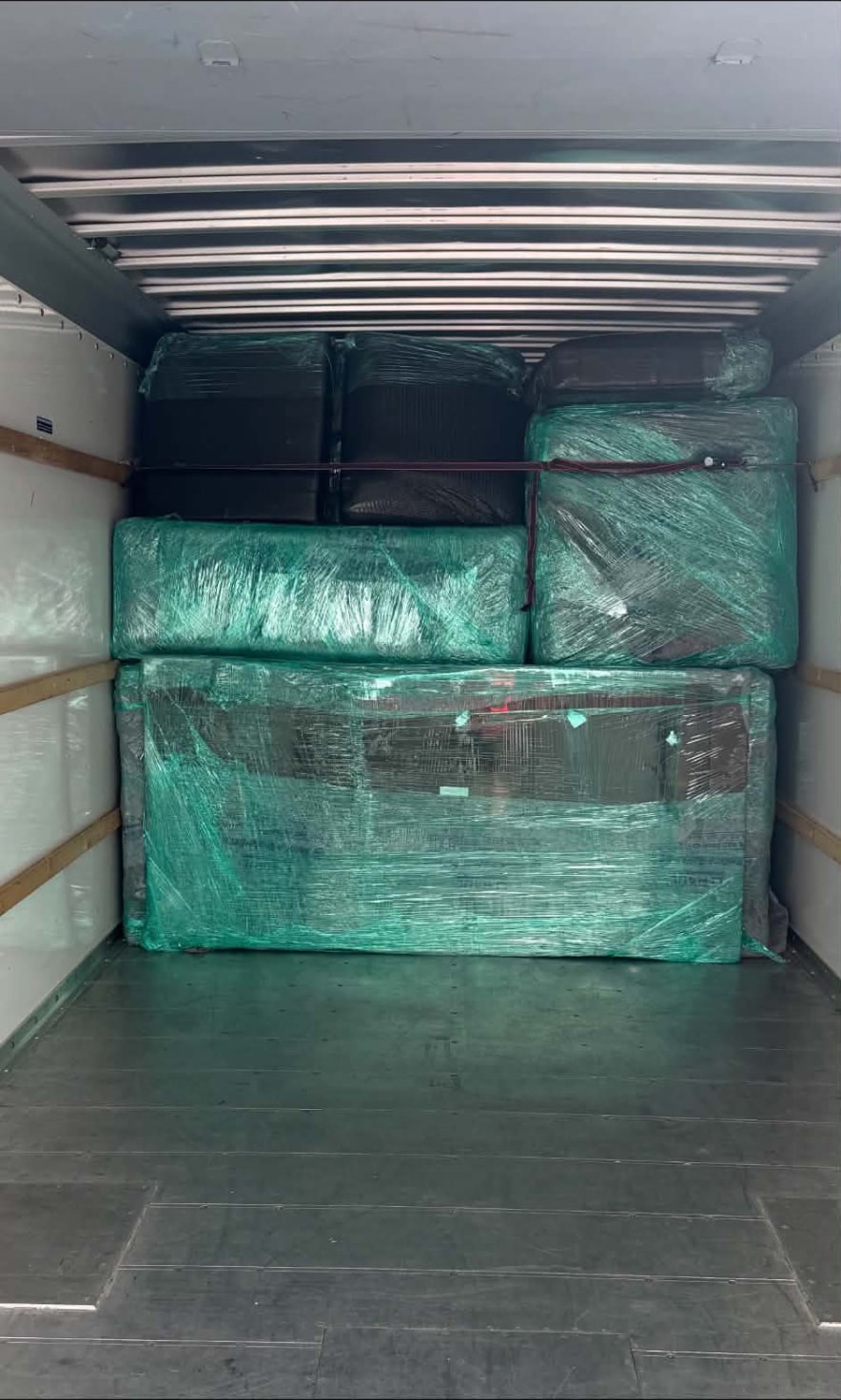 Wrapped furniture secured in the moving truck